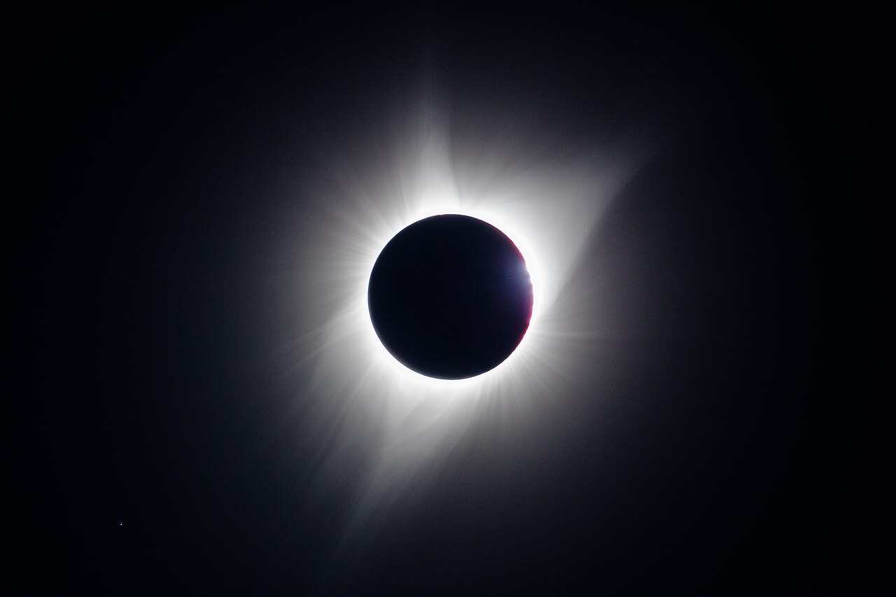 Each bead is sunlight reaching the observer through one lunar valley, so the beads measure the limb profile directly, at the position angles where they appear. Totality begins only when the last of them closes, which is why a prediction that assumes a round Moon states the wrong second. National Park Service / Jacob W. Frank, Craters of the Moon, Idaho, 2017 August 21 13.